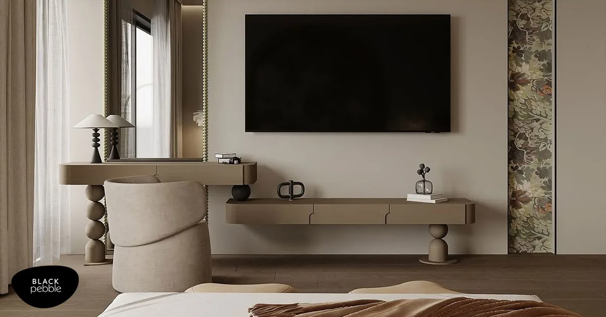 Bespoke interior design in Mangalore featuring modern TV unit, vanity, and artistic floral panel detailing